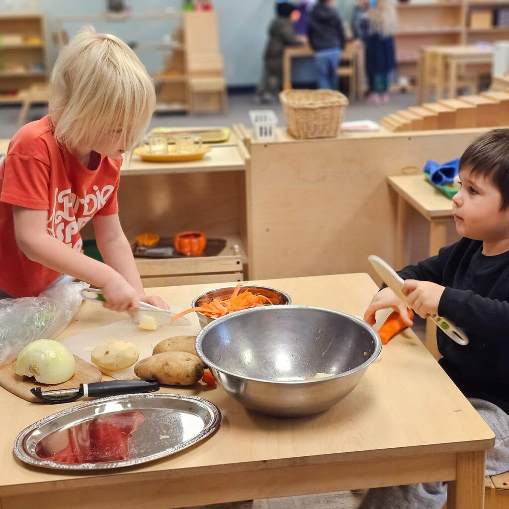 children preparing a meal together in a Montessori classroom