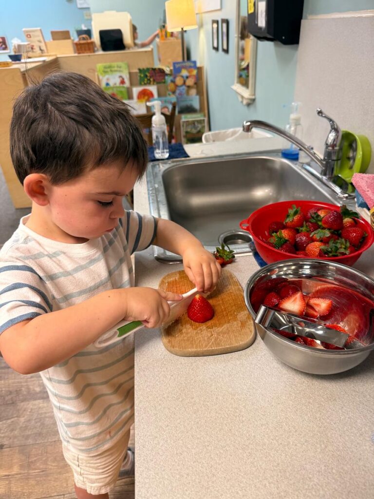 a child preparing a meal in a Montessori classroom